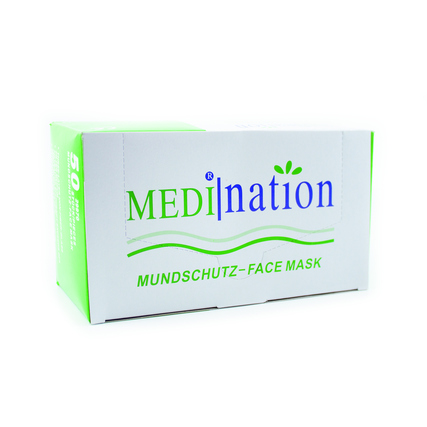Verpackung des Medination Mundschutzes in einer weißen Box mit grünen Akzenten.