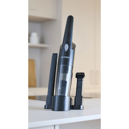 Handstaubsauger im schlanken Design mit Ladestation und Zubehörteilen auf einer Oberfläche.