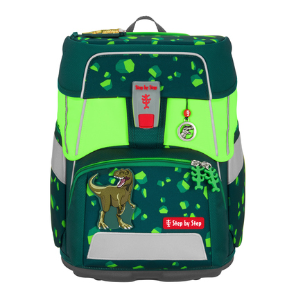 Neongrüner Ranzenüberzug mit reflektierenden Elementen und Dinosaurier-Dekor auf einem Schulranzen.