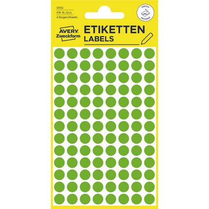 Grüne, wieder ablösbare Markierungspunkte auf einem gelben Etikettenbogen.