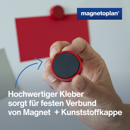 Roter Ergo-Magnet mit Hand im Fokus, zeigt die spezielle Kleberverbindung zur Kunststoffkappe.