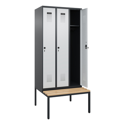 Kleiderspind mit drei Abteilen und untergebauter Sitzbank in schwarzgrau und lichtgrau.