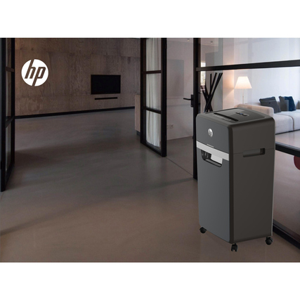 HP Aktenvernichter Pro Shredder 16MC in einem modernen Raum mit feststellbaren Rollen.