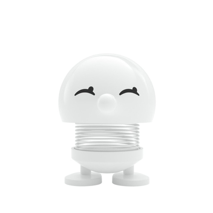 Dekorationsfigur Bimble S in Weiß mit lächelndem Gesicht und rundem Design auf einer Feder.