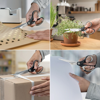Universalschere in Verwendung beim Schneiden von Papier, Geschenkkarton und Verpackungsmaterial.