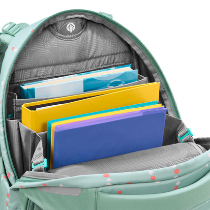 Schulrucksack COOCAZOO PORTER mit eingelegten Heften und mehreren Fächern für Organisation.