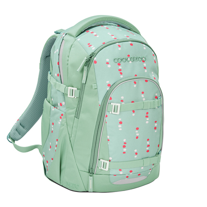 Grüner Schulrucksack mit bunten Punkten, seitliche Riemen und große Hauptöffnung.