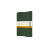 Moleskine Notizbuch Classic Softcover XL in myrtengrün mit Papierbanderole und Gummibandverschluss.