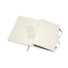 Offenes Moleskine Notizbuch Classic Softcover XL mit Innentasche und Informationsblatt.