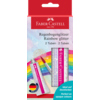 Zwei Tuben Regenbogenglitzer in Verpackung mit Farbmustern und Pinsel im Hintergrund.