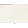 Offene Doppelseite eines Moleskine Buchkalenders mit Kalenderansicht und Platz für Notizen.