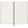 Geöffneter schwarzer Moleskine Buchkalender mit Wochenterminen und linierten Notizseiten.